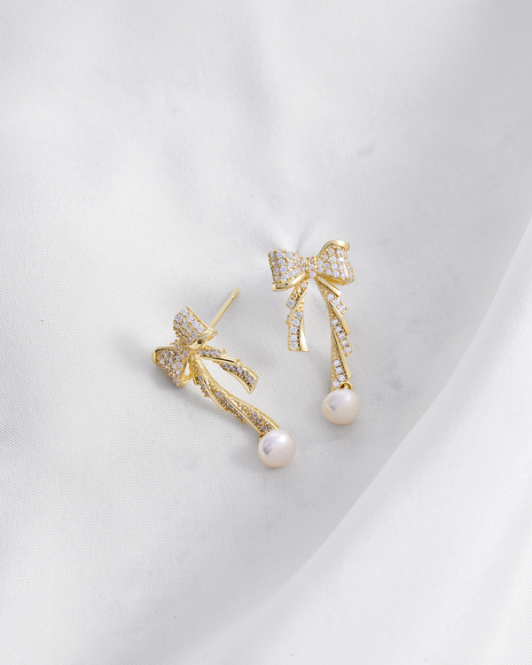 Aretes  baño de oro moño en circonitas y perla A50